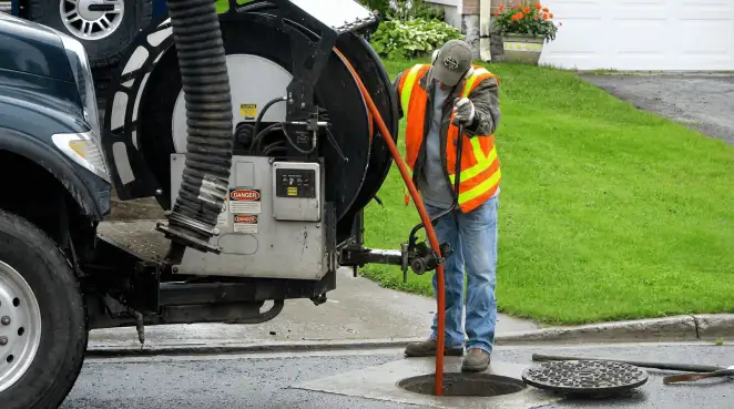 Technician using specialized drainage equipment for sewer line cleaning and foundation protection in Cleveland, OH