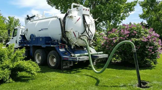 Professional vacuum truck performing residential drainage and septic maintenance in Cleveland, OH
